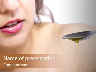 A Woman Is Holding A Spoon With Oil On It PowerPoint Template