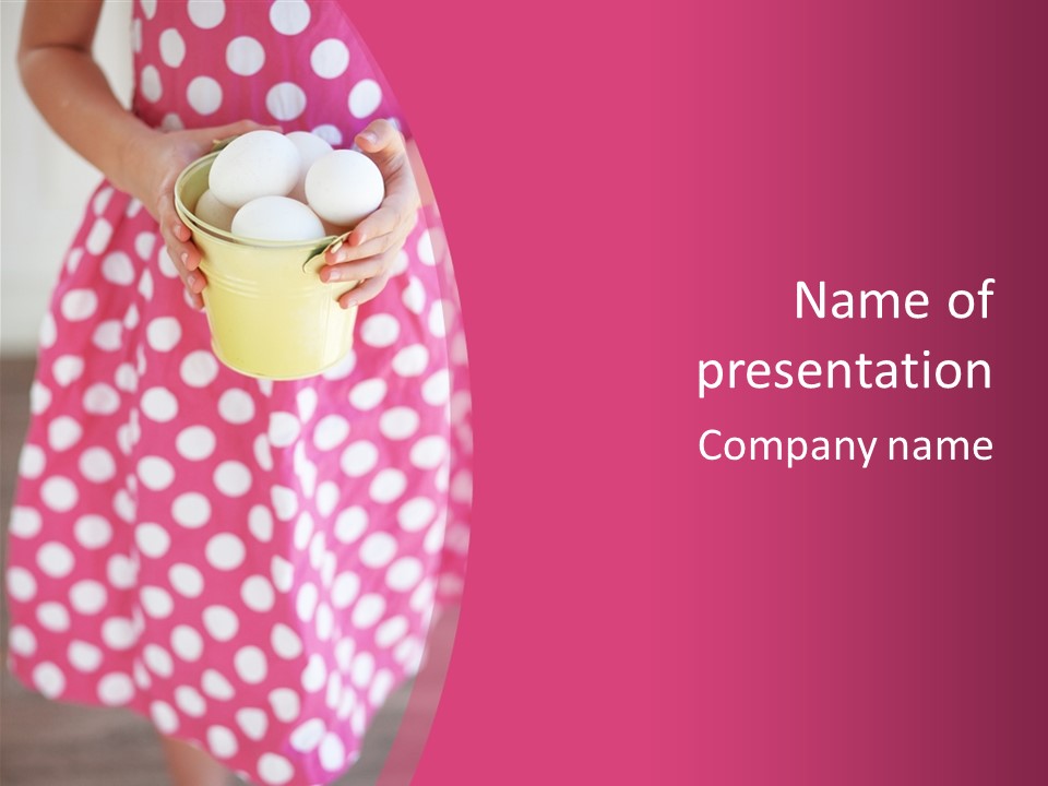 A Little Girl Holding A Cup With Eggs In It PowerPoint Template