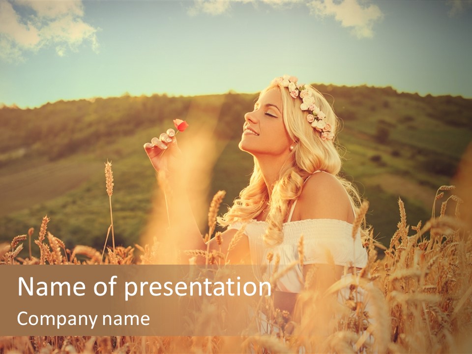 A Woman In A Field Of Wheat With A Flower In Her Hair PowerPoint Template