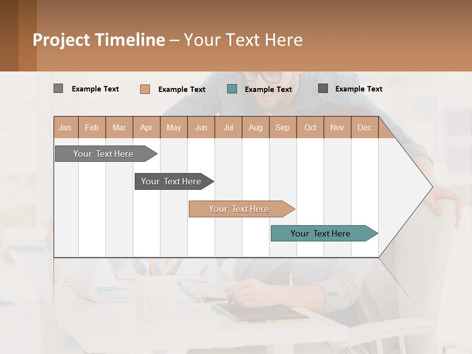 A Man And A Woman Sitting At A Desk Looking At A Computer Screen PowerPoint Template