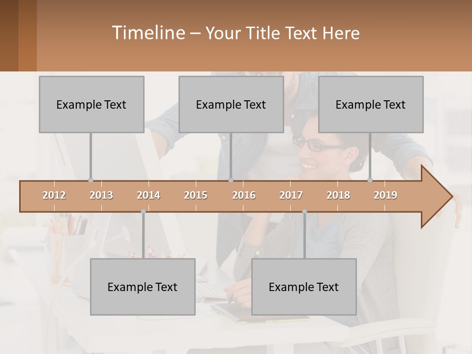 A Man And A Woman Sitting At A Desk Looking At A Computer Screen PowerPoint Template