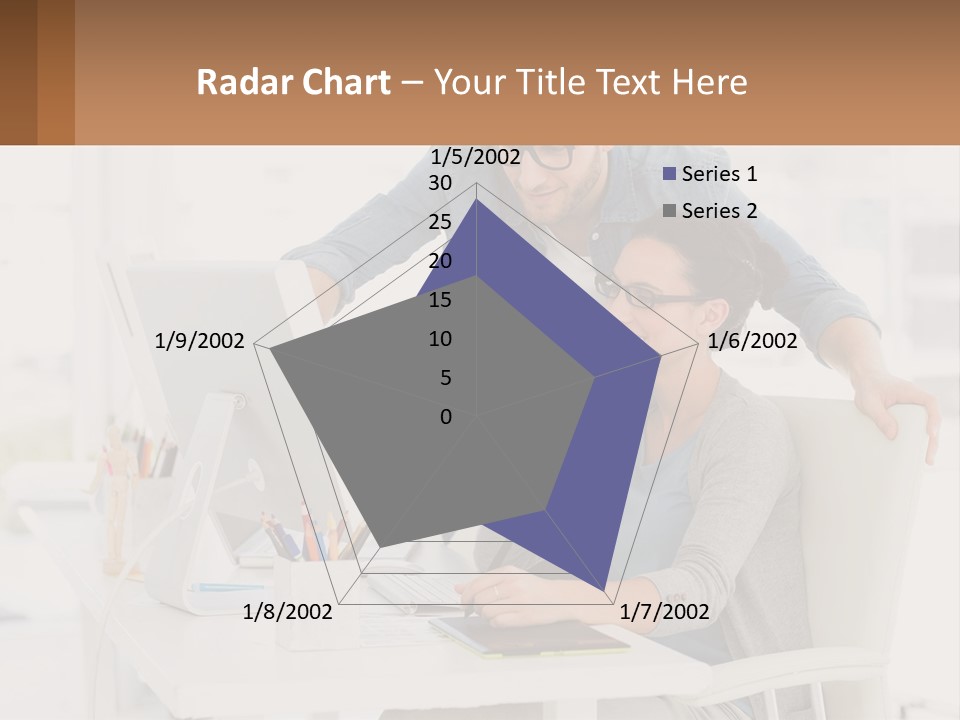 A Man And A Woman Sitting At A Desk Looking At A Computer Screen PowerPoint Template