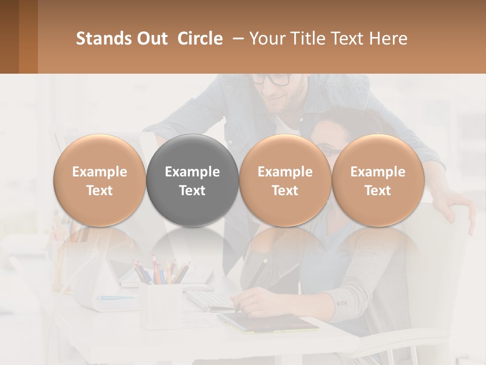 A Man And A Woman Sitting At A Desk Looking At A Computer Screen PowerPoint Template