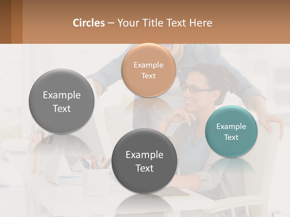 A Man And A Woman Sitting At A Desk Looking At A Computer Screen PowerPoint Template