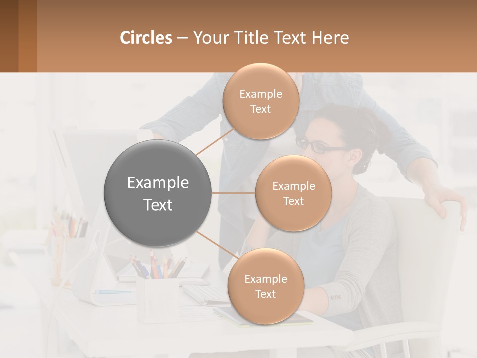 A Man And A Woman Sitting At A Desk Looking At A Computer Screen PowerPoint Template