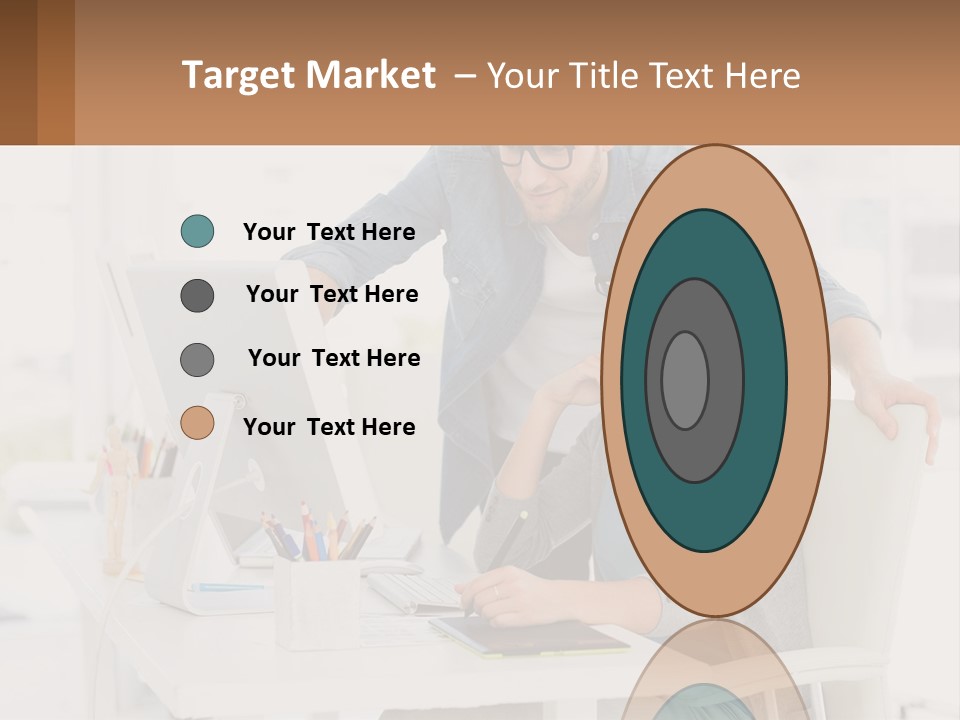 A Man And A Woman Sitting At A Desk Looking At A Computer Screen PowerPoint Template