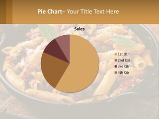 A Skillet Filled With Pasta And Meat On Top Of A Wooden Table PowerPoint Template