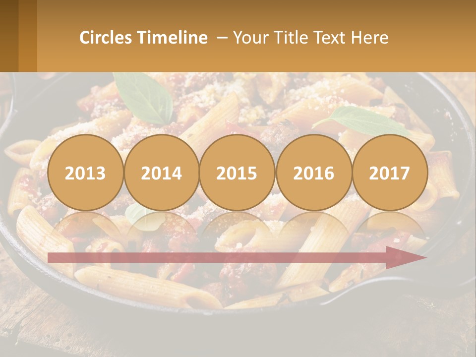 A Skillet Filled With Pasta And Meat On Top Of A Wooden Table PowerPoint Template
