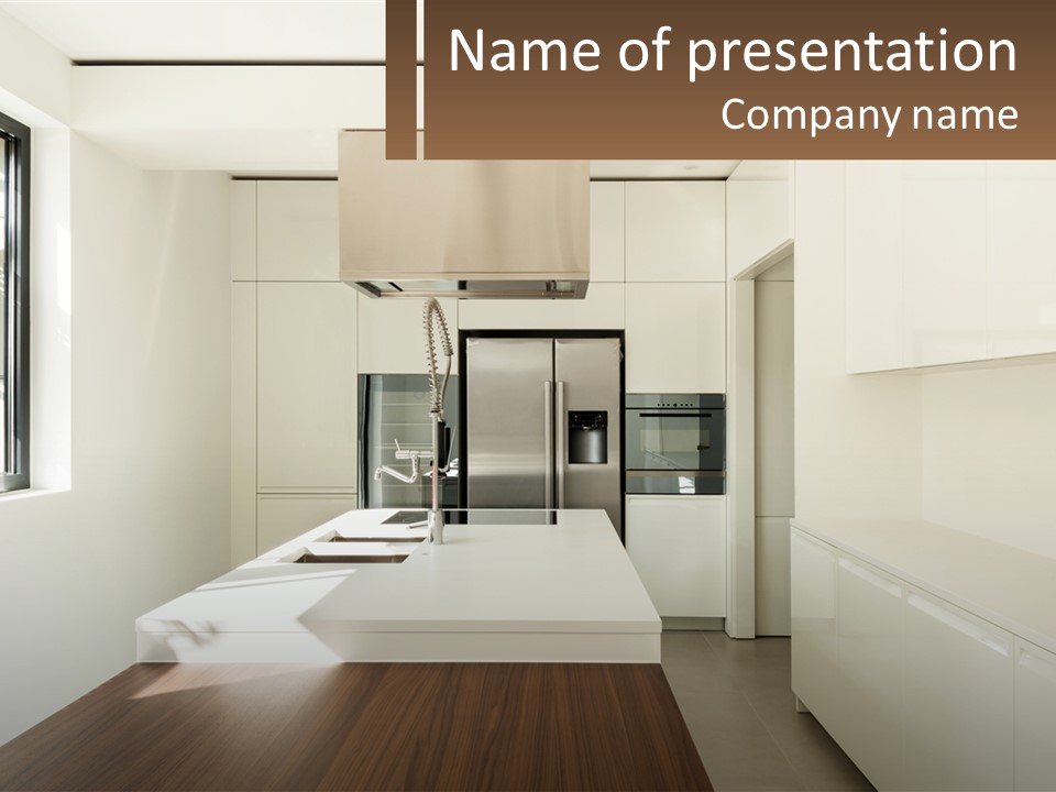 A White Kitchen With A Wooden Counter Top PowerPoint Template