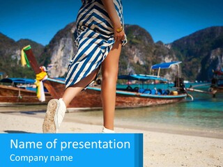 A Woman Walking On A Beach With Boats In The Background PowerPoint Template