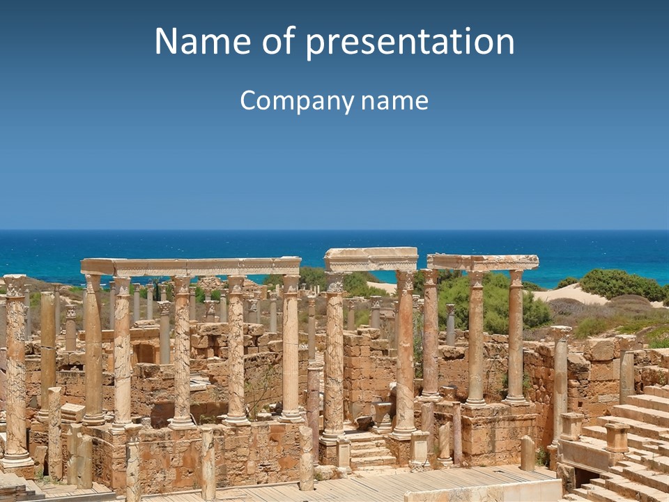 A Large Group Of Ruins In Front Of A Body Of Water PowerPoint Template