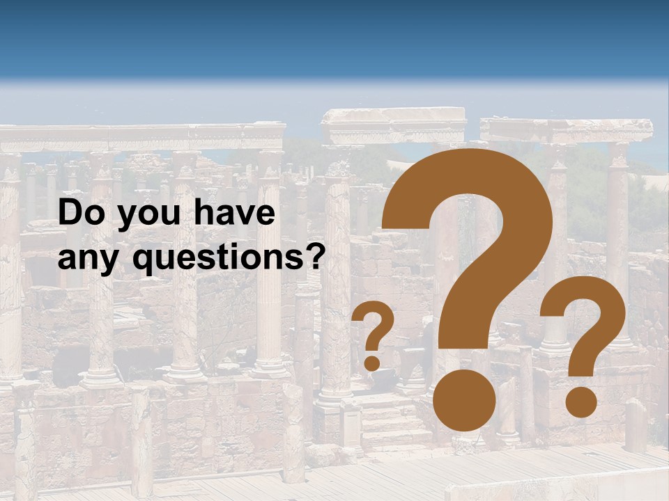 A Large Group Of Ruins In Front Of A Body Of Water PowerPoint Template