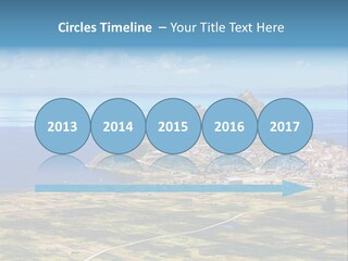 A Small Island In The Middle Of A Large Body Of Water PowerPoint Template