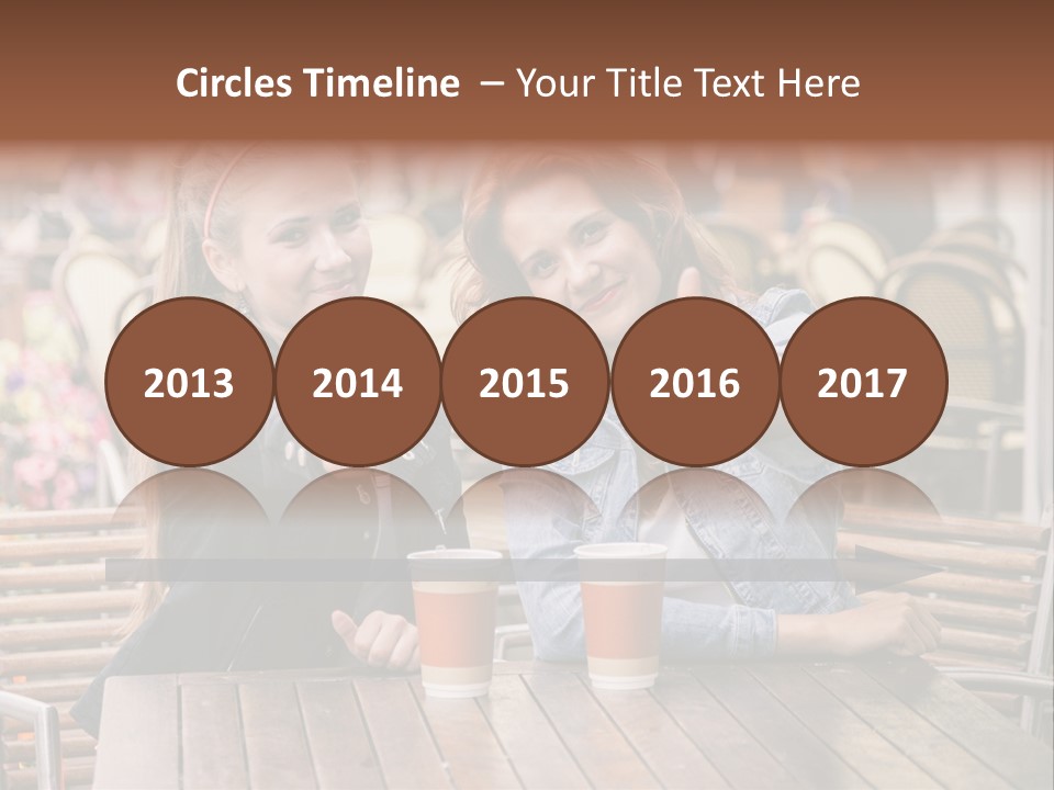 Two Girls Giving Thumbs Up At A Table PowerPoint Template