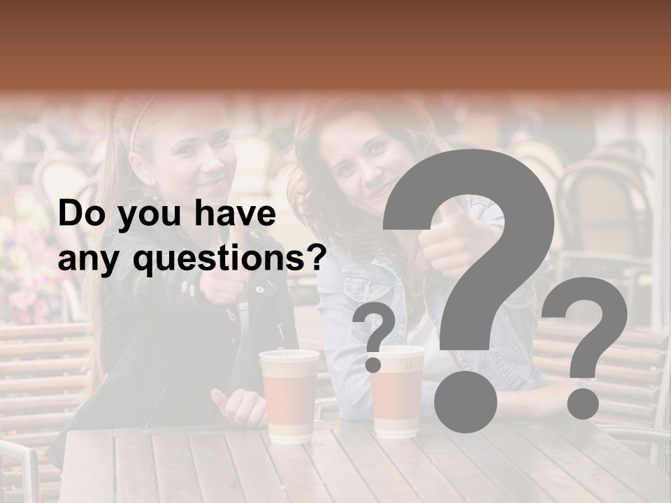 Two Girls Giving Thumbs Up At A Table PowerPoint Template