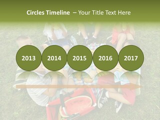 A Group Of Children Sitting On A Blanket Eating Food PowerPoint Template