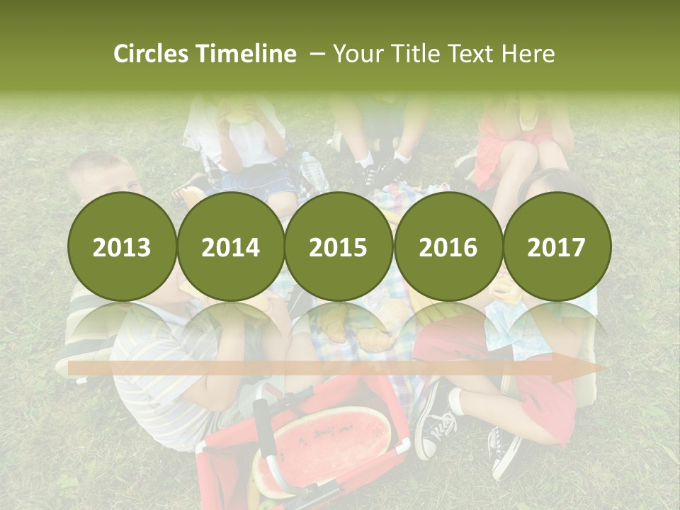 A Group Of Children Sitting On A Blanket Eating Food PowerPoint Template