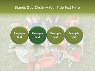 A Group Of Children Sitting On A Blanket Eating Food PowerPoint Template