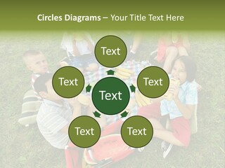 A Group Of Children Sitting On A Blanket Eating Food PowerPoint Template
