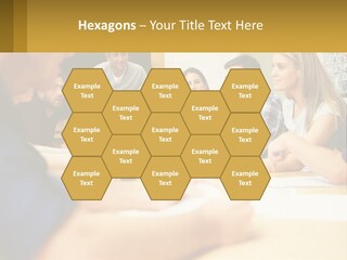 A Group Of People Sitting Around A Conference Table PowerPoint Template