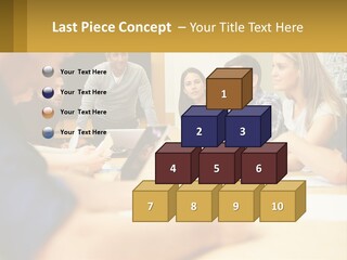 A Group Of People Sitting Around A Conference Table PowerPoint Template