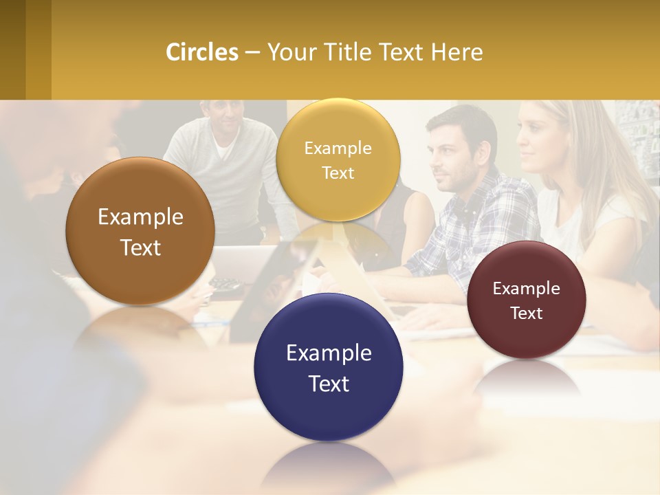 A Group Of People Sitting Around A Conference Table PowerPoint Template