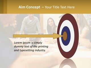 A Group Of People Sitting Around A Conference Table PowerPoint Template