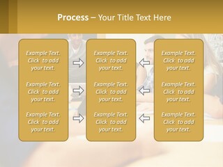 A Group Of People Sitting Around A Conference Table PowerPoint Template