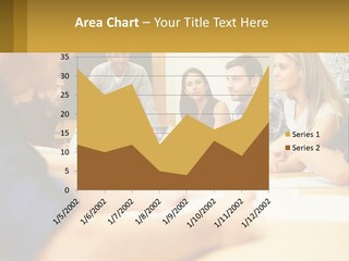 A Group Of People Sitting Around A Conference Table PowerPoint Template