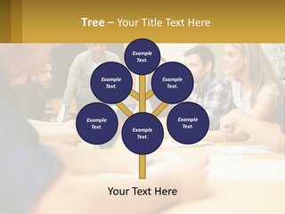 A Group Of People Sitting Around A Conference Table PowerPoint Template