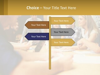 A Group Of People Sitting Around A Conference Table PowerPoint Template
