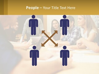 A Group Of People Sitting Around A Conference Table PowerPoint Template