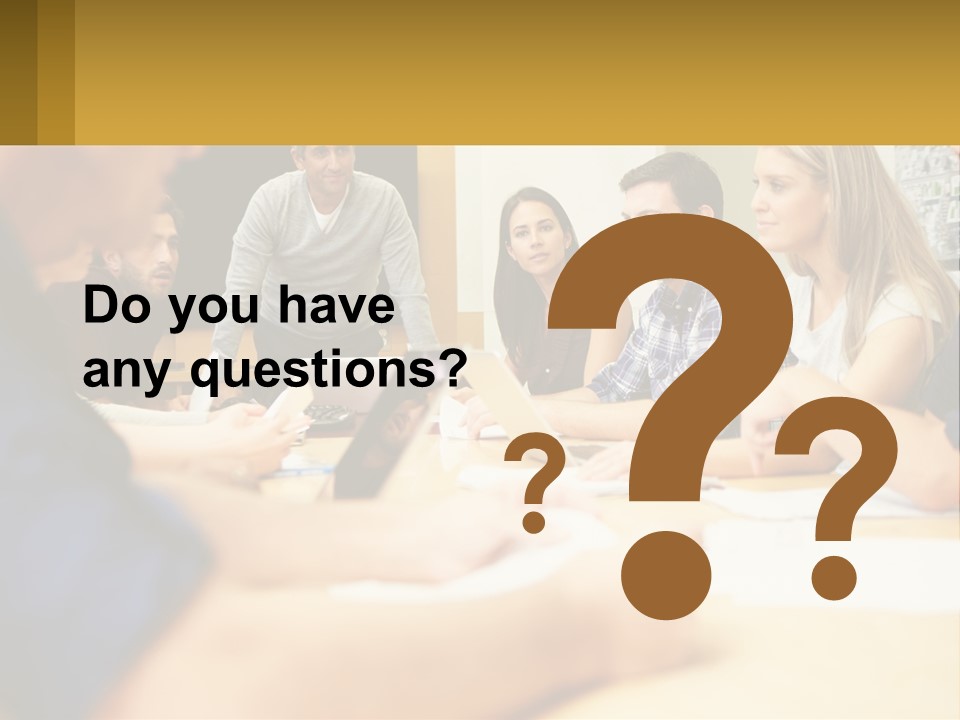 A Group Of People Sitting Around A Conference Table PowerPoint Template