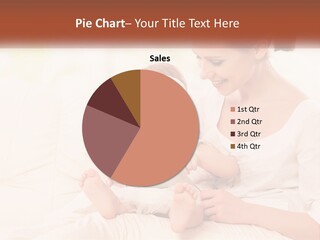 A Woman Holding A Baby While Looking At A Tablet PowerPoint Template