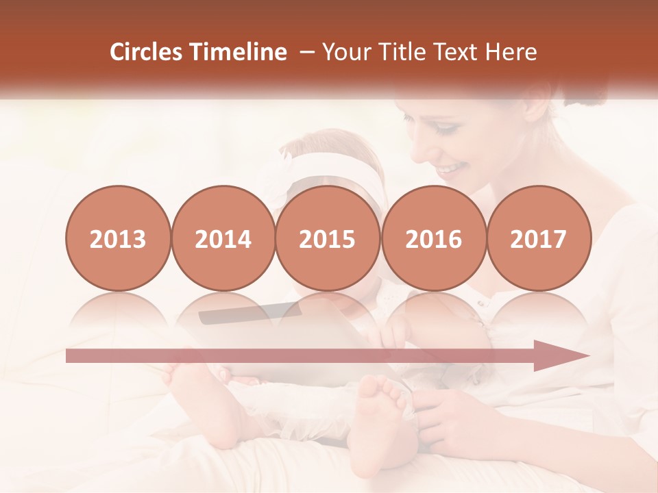 A Woman Holding A Baby While Looking At A Tablet PowerPoint Template