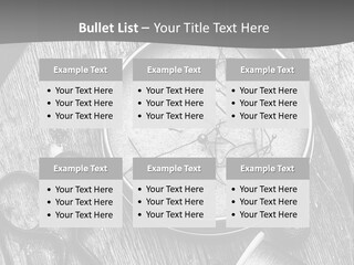 A Black And White Photo Of Scissors And A Hat On A Wooden Table PowerPoint Template