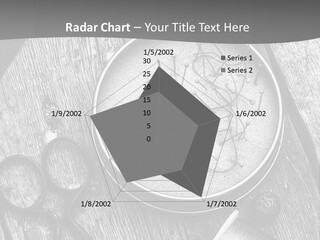 A Black And White Photo Of Scissors And A Hat On A Wooden Table PowerPoint Template