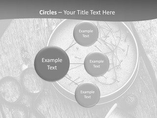 A Black And White Photo Of Scissors And A Hat On A Wooden Table PowerPoint Template