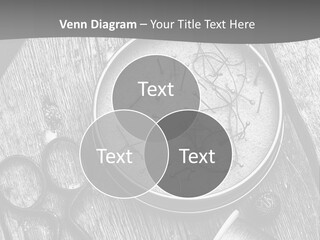 A Black And White Photo Of Scissors And A Hat On A Wooden Table PowerPoint Template