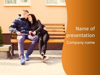 A Man And Woman Sitting On A Bench In Front Of A Building PowerPoint Template