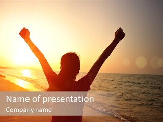 A Person Standing On A Beach With Their Arms In The Air PowerPoint Template