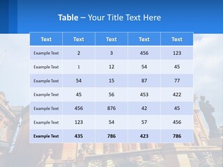 A Large Building With Columns And A Clock On It PowerPoint Template