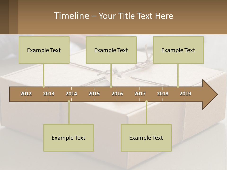 A Person Writing On A Piece Of Paper Next To A Wrapped Present Box PowerPoint Template