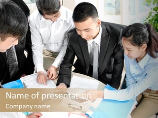 A Group Of People Sitting Around A Table With Papers PowerPoint Template