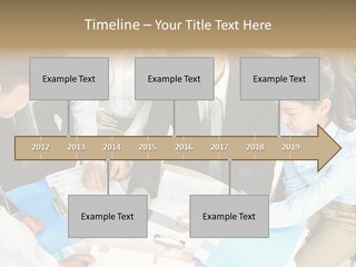 A Group Of People Sitting Around A Table With Papers PowerPoint Template