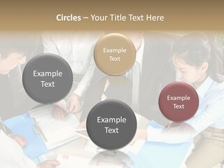 A Group Of People Sitting Around A Table With Papers PowerPoint Template