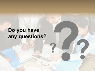 A Group Of People Sitting Around A Table With Papers PowerPoint Template