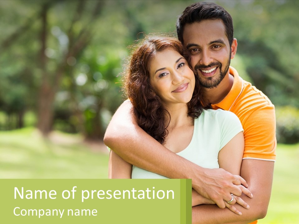A Man And Woman Hugging Each Other In A Park PowerPoint Template