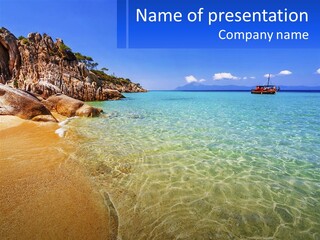 A Beach With A Boat In The Water PowerPoint Template