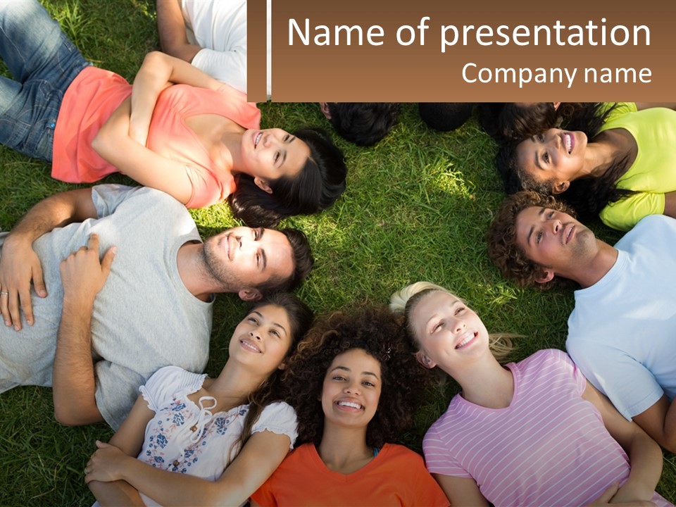 A Group Of People Laying In A Circle On The Grass PowerPoint Template